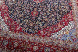 Close-up detail of 2000s Kashan rug from Iran / Persia showing Wool weave