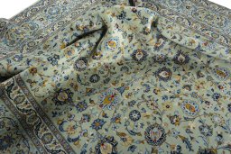 Surface texture of 2000s Kashan rug with natural Wool and intricate pattern