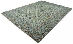 Corner detail of 2000s Kashan rug showing border pattern and Wool pile
