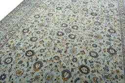 Backside of handmade 2000s Kashan rug showing knot structure and weave density