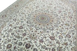 Backside of handmade 2000s Kashan rug showing knot structure and weave density