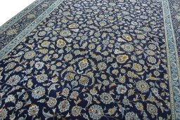 Close-up detail of 2000s Kashan rug from Iran / Persia showing Wool weave