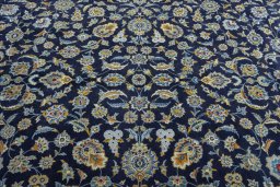 Surface texture of 2000s Kashan rug with natural Wool and intricate pattern