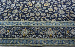 Close-up detail of 2000s Kashan rug from Iran / Persia showing Wool weave
