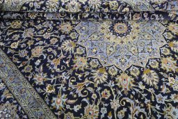 Close-up detail of 2000s Kashan rug from Iran / Persia showing Cork weave