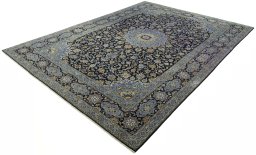 Corner detail of 2000s Kashan rug showing border pattern and Cork pile