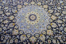 Central medallion detail of 2000s Kashan rug from Iran / Persia