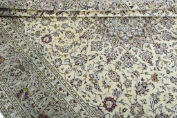 Close-up detail of 2000s Kashan rug from Iran / Persia showing Wool weave