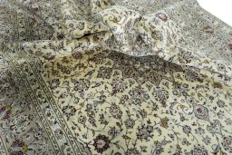 Surface texture of 2000s Kashan rug with natural Wool and intricate pattern