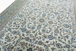 Backside of handmade 2000s Kashan rug showing knot structure and weave density