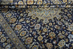 Close-up detail of 1970s Kashan rug from Iran / Persia showing Wool weave