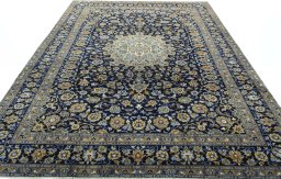Surface texture of 1970s Kashan rug with natural Wool and intricate pattern