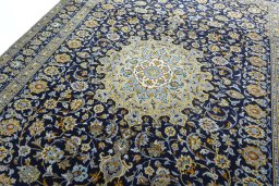 Backside of handmade 1970s Kashan rug showing knot structure and weave density