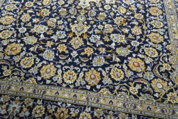 Close-up detail of 1970s Kashan rug from Iran / Persia showing Wool weave