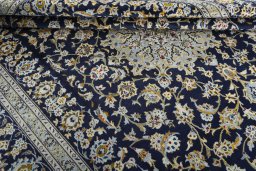 Close-up detail of 2000s Kashan rug from Iran / Persia showing Wool weave
