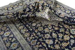 Surface texture of 2000s Kashan rug with natural Wool and intricate pattern
