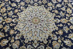 Central medallion detail of 2000s Kashan rug from Iran / Persia