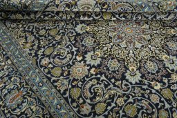 Close-up detail of 2000s Kashan rug from Iran / Persia showing Wool weave