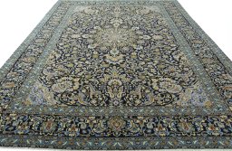 Surface texture of 2000s Kashan rug with natural Wool and intricate pattern