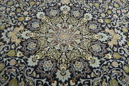 Central medallion detail of 2000s Kashan rug from Iran / Persia