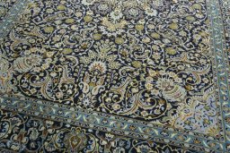 Close-up detail of 2000s Kashan rug from Iran / Persia showing Wool weave