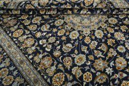 Close-up detail of 2000s Kashan rug from Iran / Persia showing Wool weave