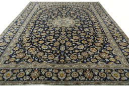 Surface texture of 2000s Kashan rug with natural Wool and intricate pattern