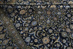 Close-up detail of 2000s Kashan rug from Iran / Persia showing Wool weave