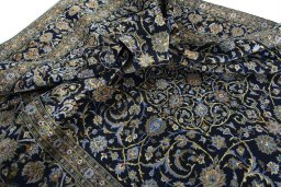 Surface texture of 2000s Kashan rug with natural Wool and intricate pattern