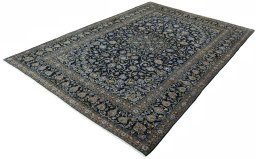 Corner detail of 2000s Kashan rug showing border pattern and Wool pile