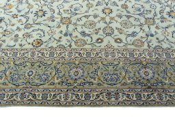 Corner detail of 1970s Kashan rug showing border pattern and Wool pile