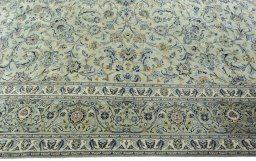 Corner detail of 1970s Kashan rug showing border pattern and Wool pile