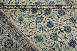 Close-up detail of 2000s Kashan rug from Iran / Persia showing Wool weave