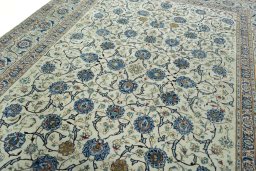 Backside of handmade 2000s Kashan rug showing knot structure and weave density