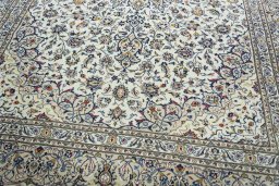 Close-up detail of 2000s Kashan rug from Iran / Persia showing Wool weave