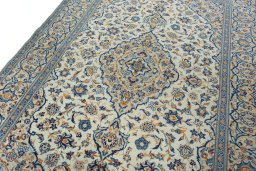Backside of handmade 2000s Kashan rug showing knot structure and weave density