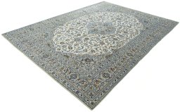 Corner detail of 2000s Kashan rug showing border pattern and Wool pile