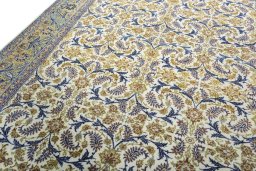 Backside of handmade 1970s Kashan rug showing knot structure and weave density