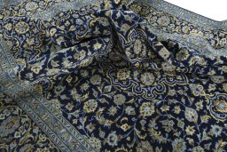 Surface texture of 2000s Kashan rug with natural Wool and intricate pattern