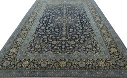 Surface texture of 2000s Kashan rug with natural Wool and intricate pattern
