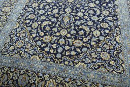 Close-up detail of 2000s Kashan rug from Iran / Persia showing Wool weave