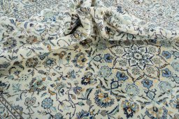 Surface texture of 2000s Kashan rug with natural Wool and intricate pattern