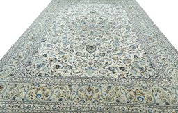 Surface texture of 2000s Kashan rug with natural Wool and intricate pattern