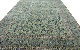 Surface texture of 2000s Kashan rug with natural Wool and intricate pattern