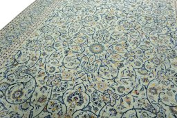 Backside of handmade 2000s Kashan rug showing knot structure and weave density