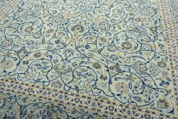 Close-up detail of 2000s Kashan rug from Iran / Persia showing Wool weave