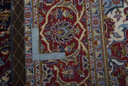 Backside of handmade New Kashan rug showing knot structure and weave density