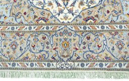 Corner detail of New Kashan rug showing border pattern and Cork pile