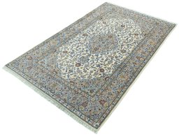 Corner detail of New Kashan rug showing border pattern and Cork pile