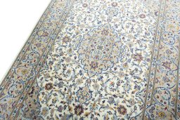 Backside of handmade New Kashan rug showing knot structure and weave density